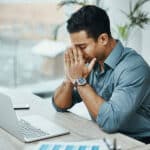 Man with Headache at Computer