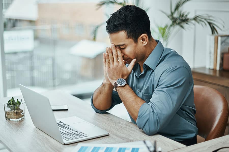 Man with Headache at Computer