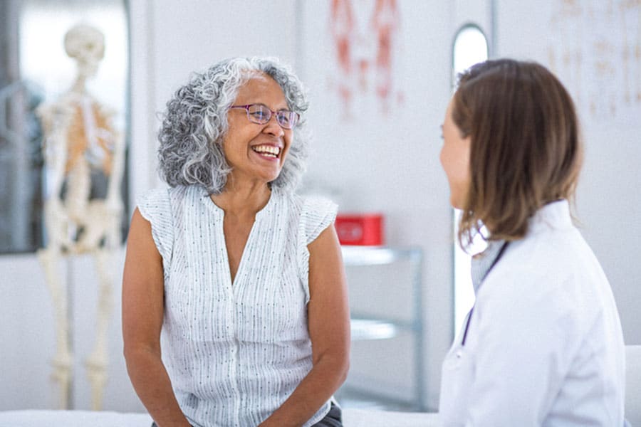 Woman patient talking to doctor